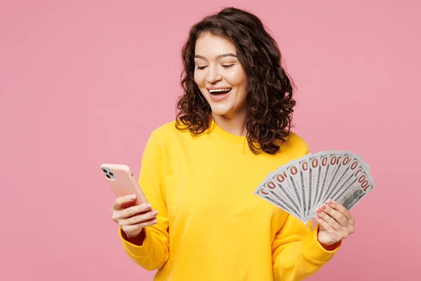 Woman with phone and money