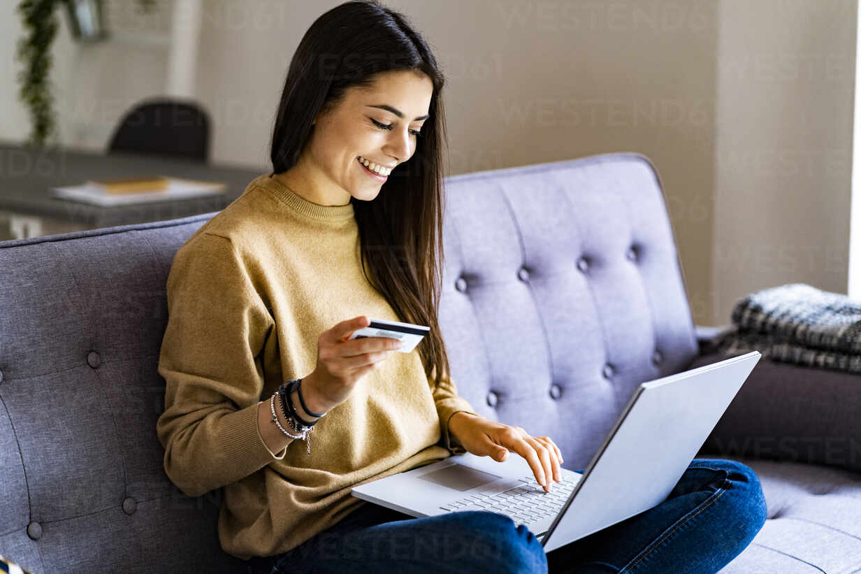 Woman shopping on her laptop